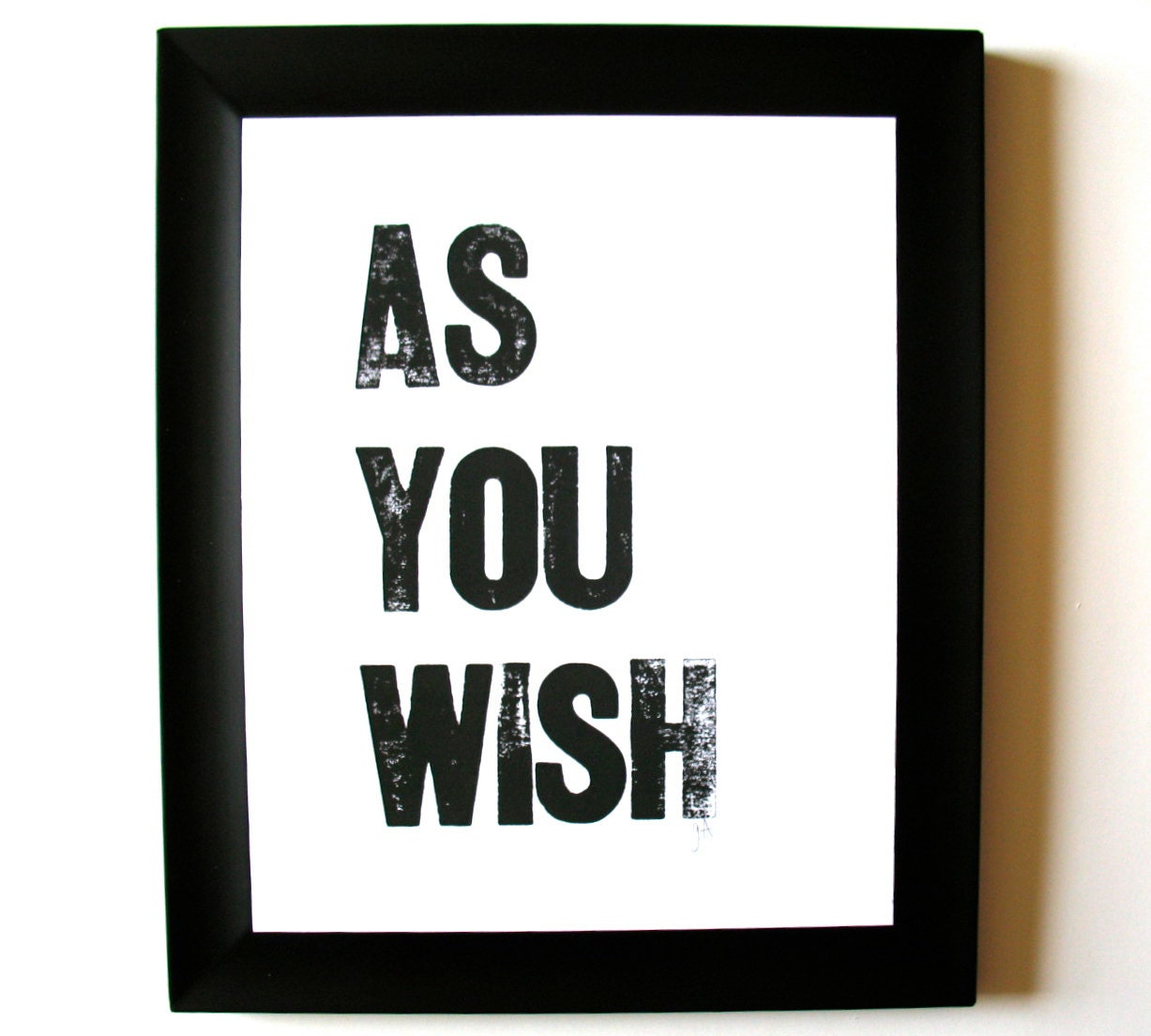 Framed print with 'AS YOU WISH' text on a white background