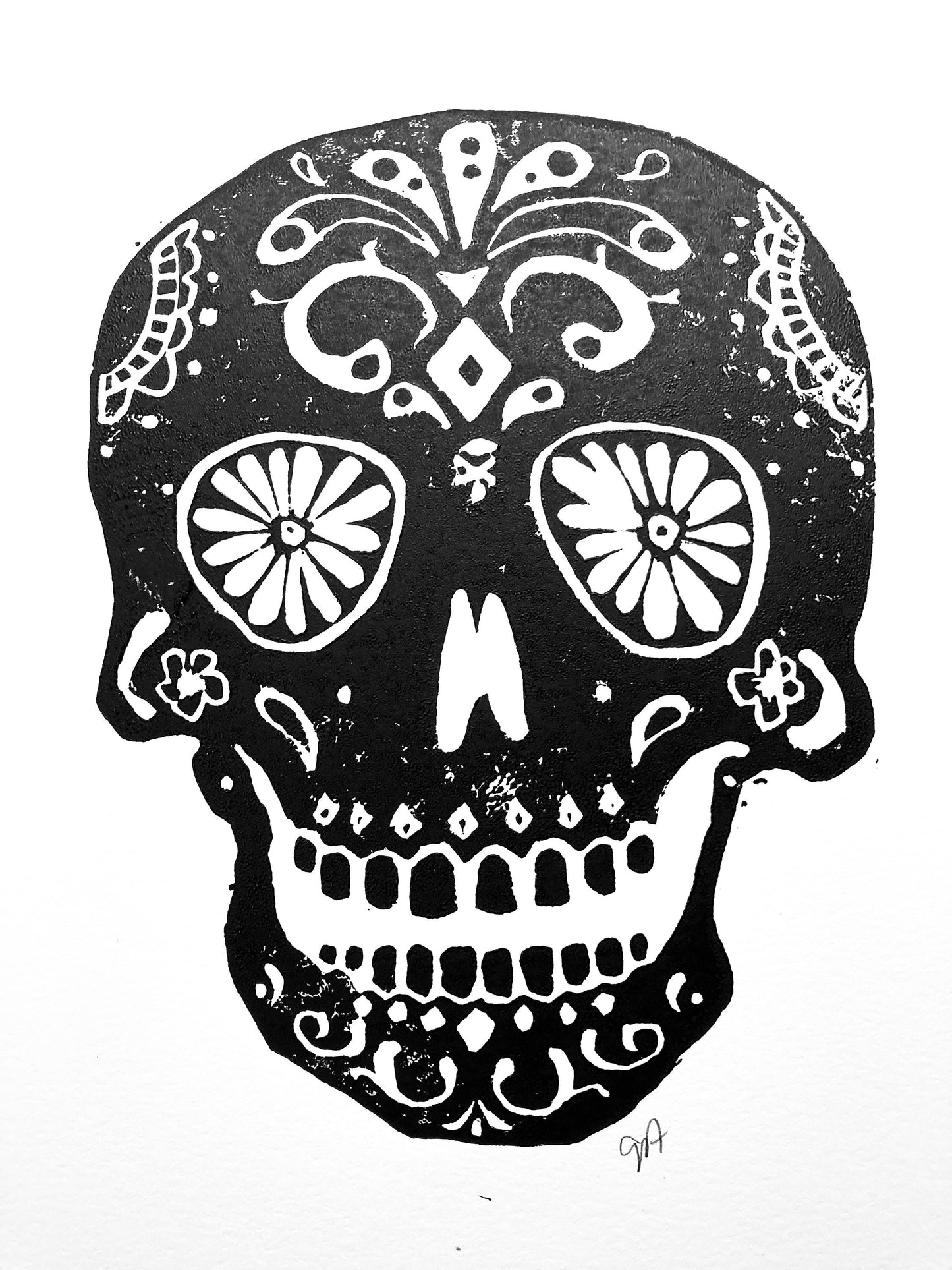 Black and white sugar skull with intricate patterns on a white background