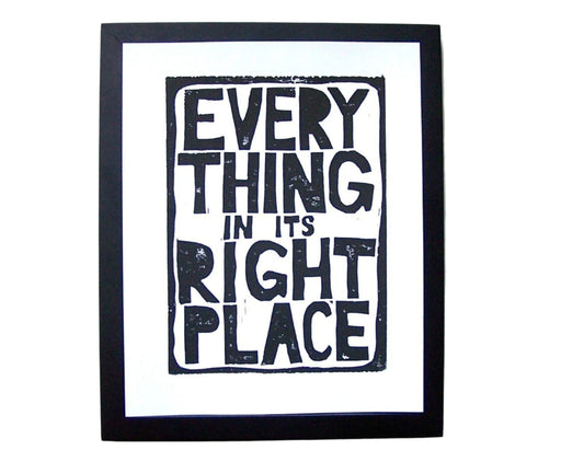 Framed artwork with text 'Everything in its right place' on a white background