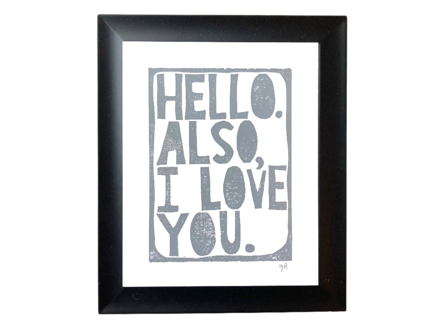 Framed print with 'Hello. Also, I love you.' text in grey on a white background