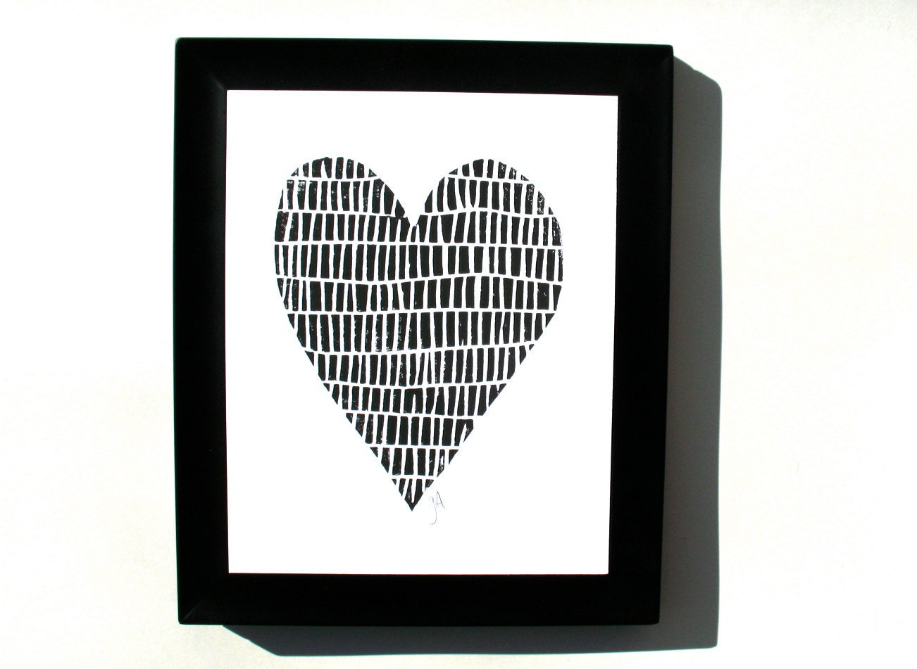 Framed linocut print of a heart