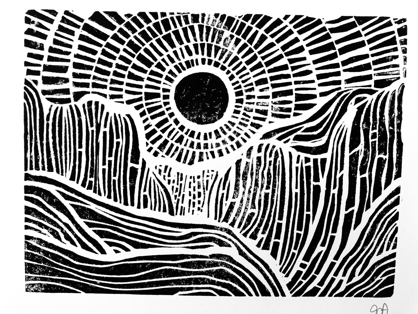 Black and white abstract design with concentric circles and wavy patterns of the sunset behind mountains