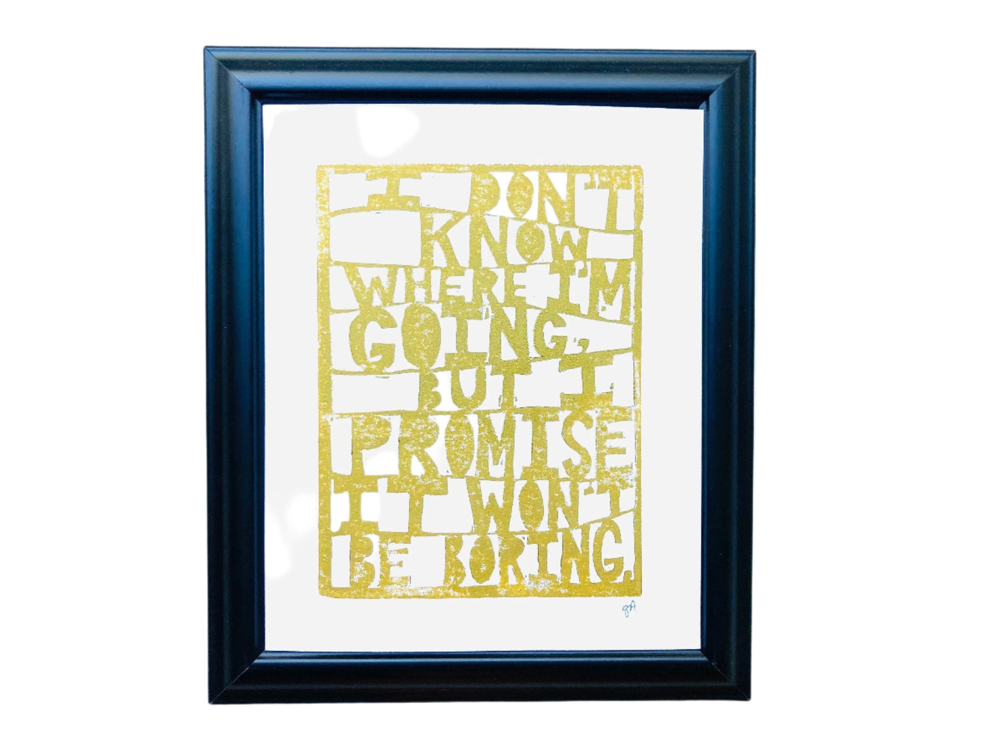 Framed  linoleum block relief print with gold text quoting David Bowie: "I don't know where I'm going but I promise it won't be boring" on a white background