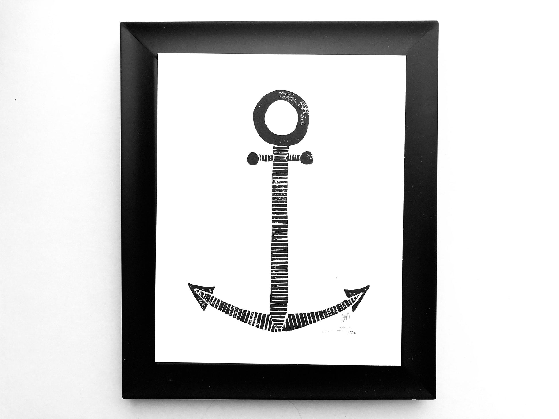 Framed black and white anchor artwork on a white background