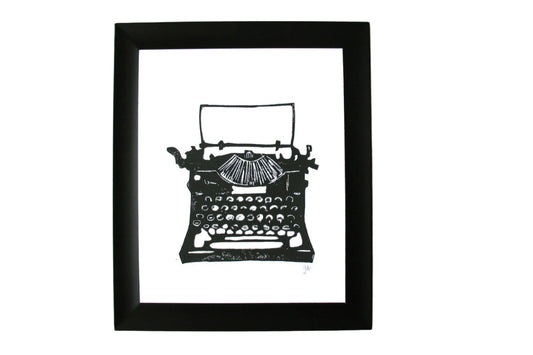 Framed linoleum block print of a black typewriter. Minimal linocut relief print of an antique typewriter, 8x10. 