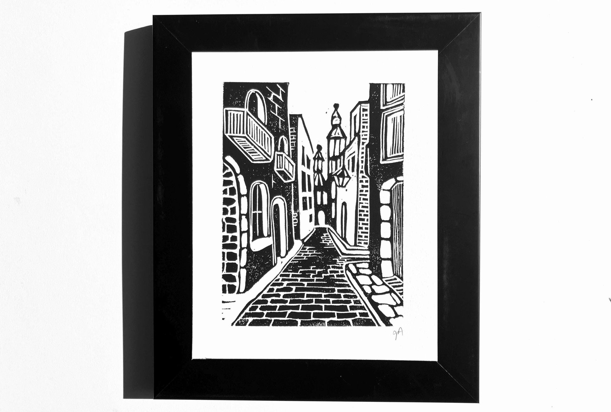 Framed black and white artwork of France cobblestones street scene.