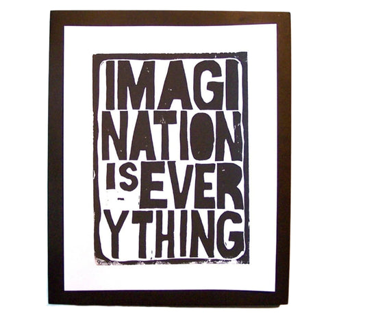 Framed poster with 'Imagination is Everything' text on a white background