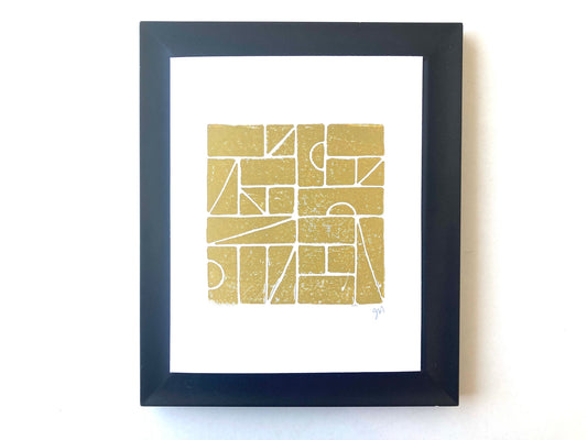 Framed artwork with geometric design on a white background