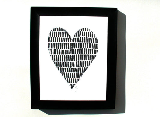 Framed linocut print of a heart