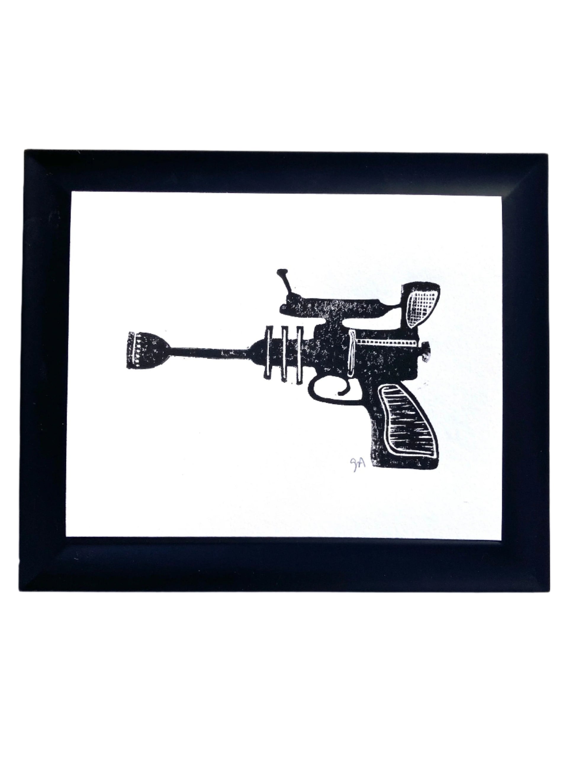 Framed black and white illustration of a ray gun on a white background