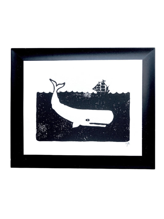 Framed linocut print of Moby Dick and ship in the ocean. Whale and whaling vessel linoleum block print. 
