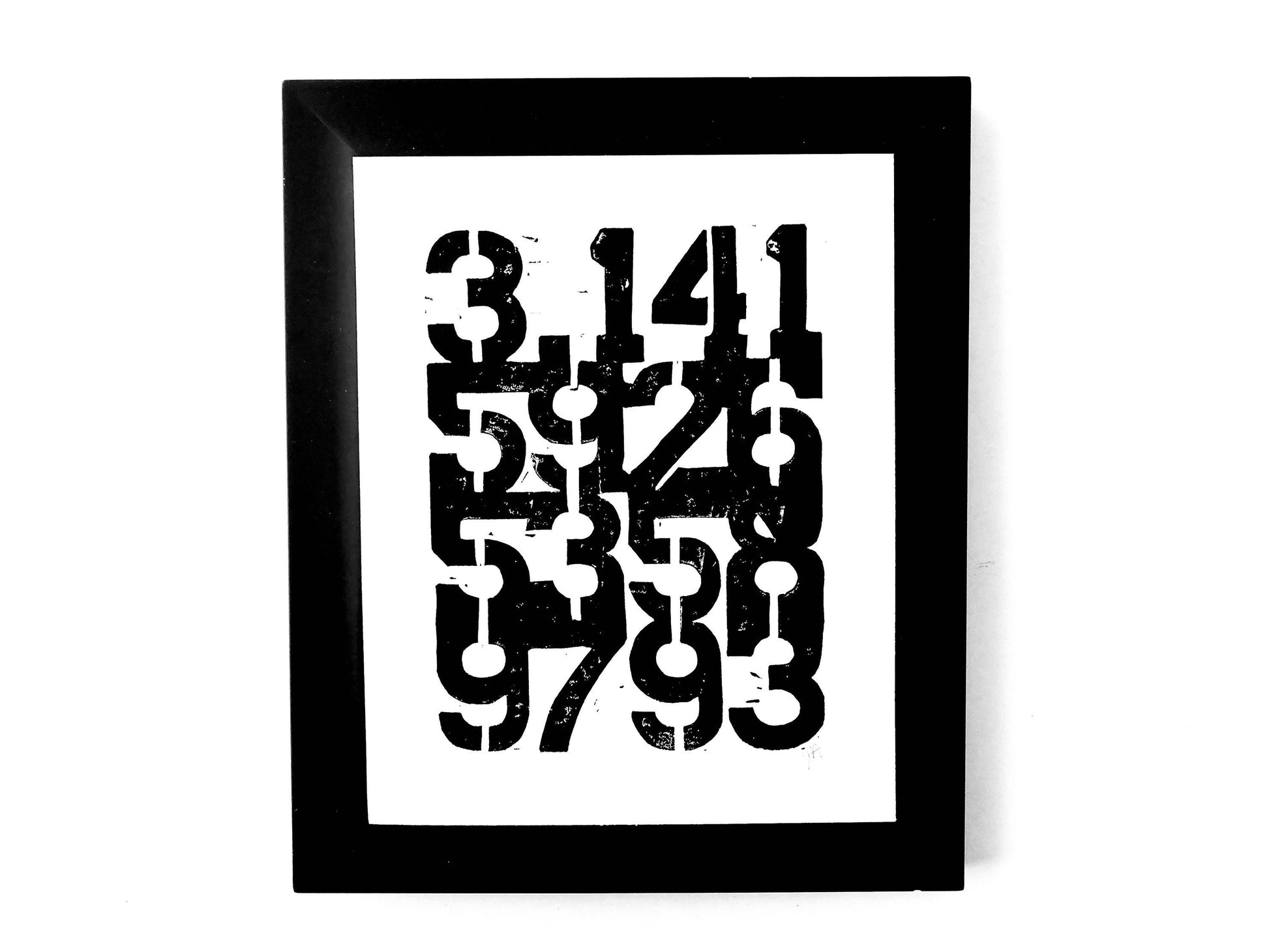 Framed artwork with a geometric design of pi on a white background