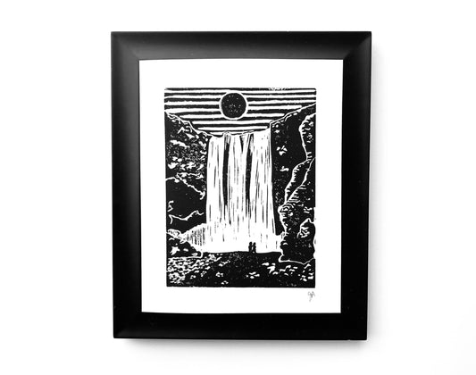 Framed black and white artwork of a waterfall