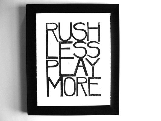 Framed black and white art print with motivational text on a plain background