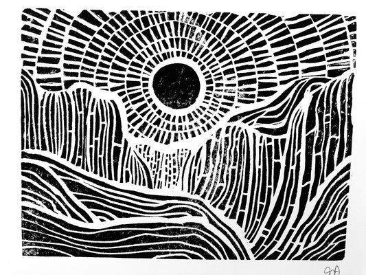 Black and white abstract design with concentric circles and wavy patterns of the sunset behind mountains