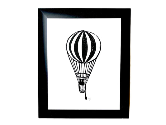 Framed original linoleum block print of a black hot air balloon, 8x10.