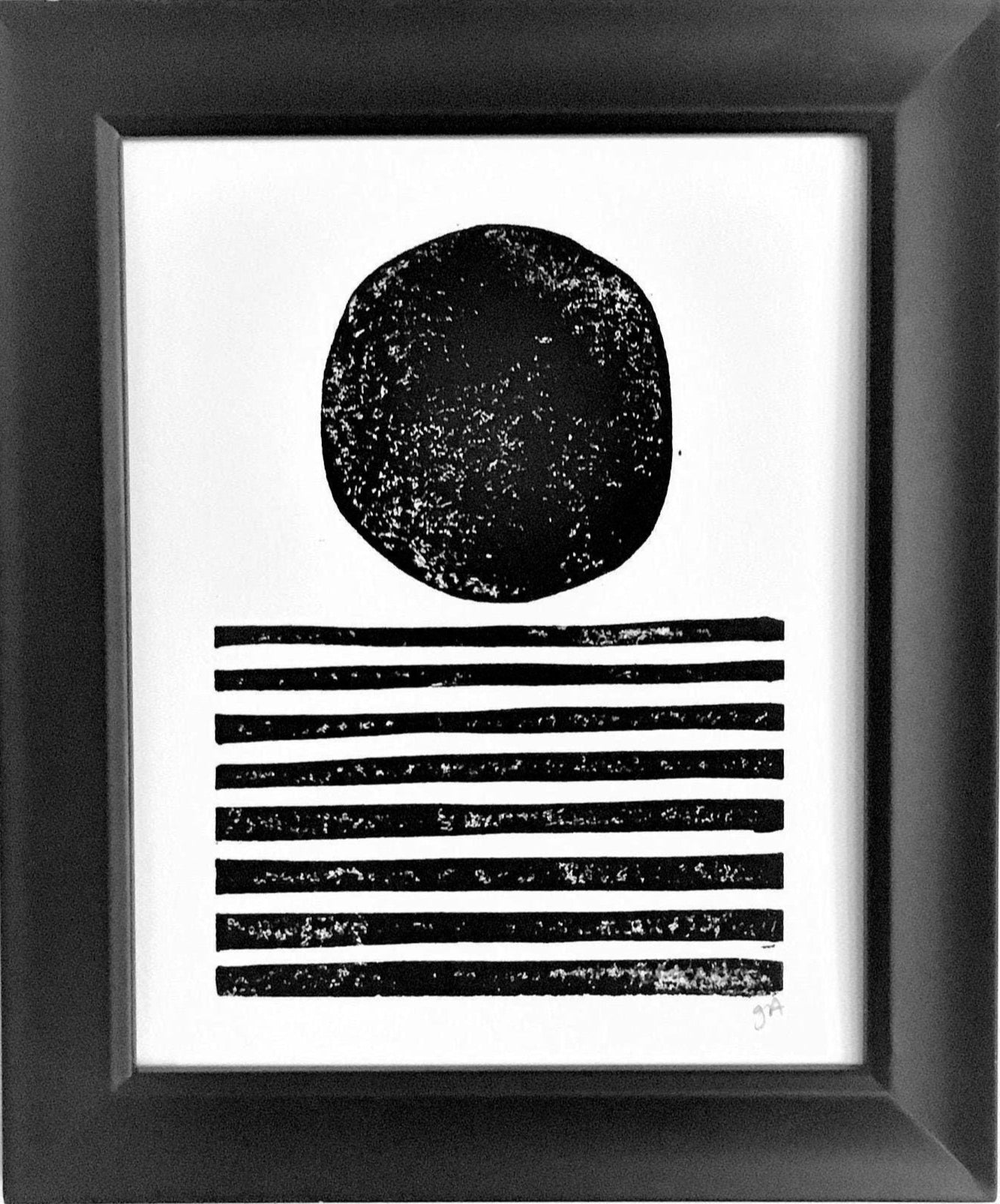 Framed black and white abstract art print on a white background