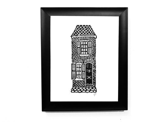 Framed black and white illustration of a building on a white background